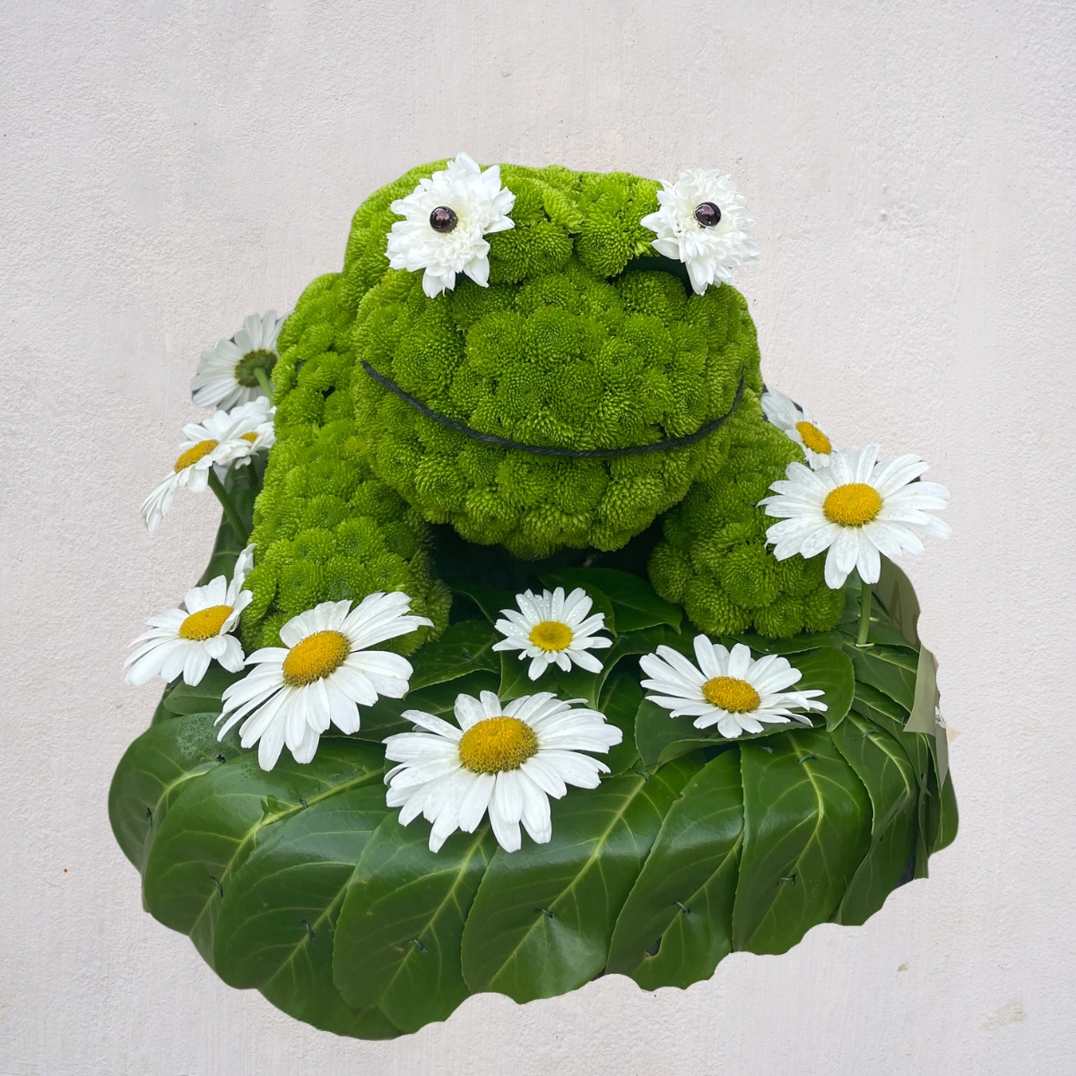 Bespoke frog-shaped floral tribute by Beloved Flowers, funeral florist in Kent