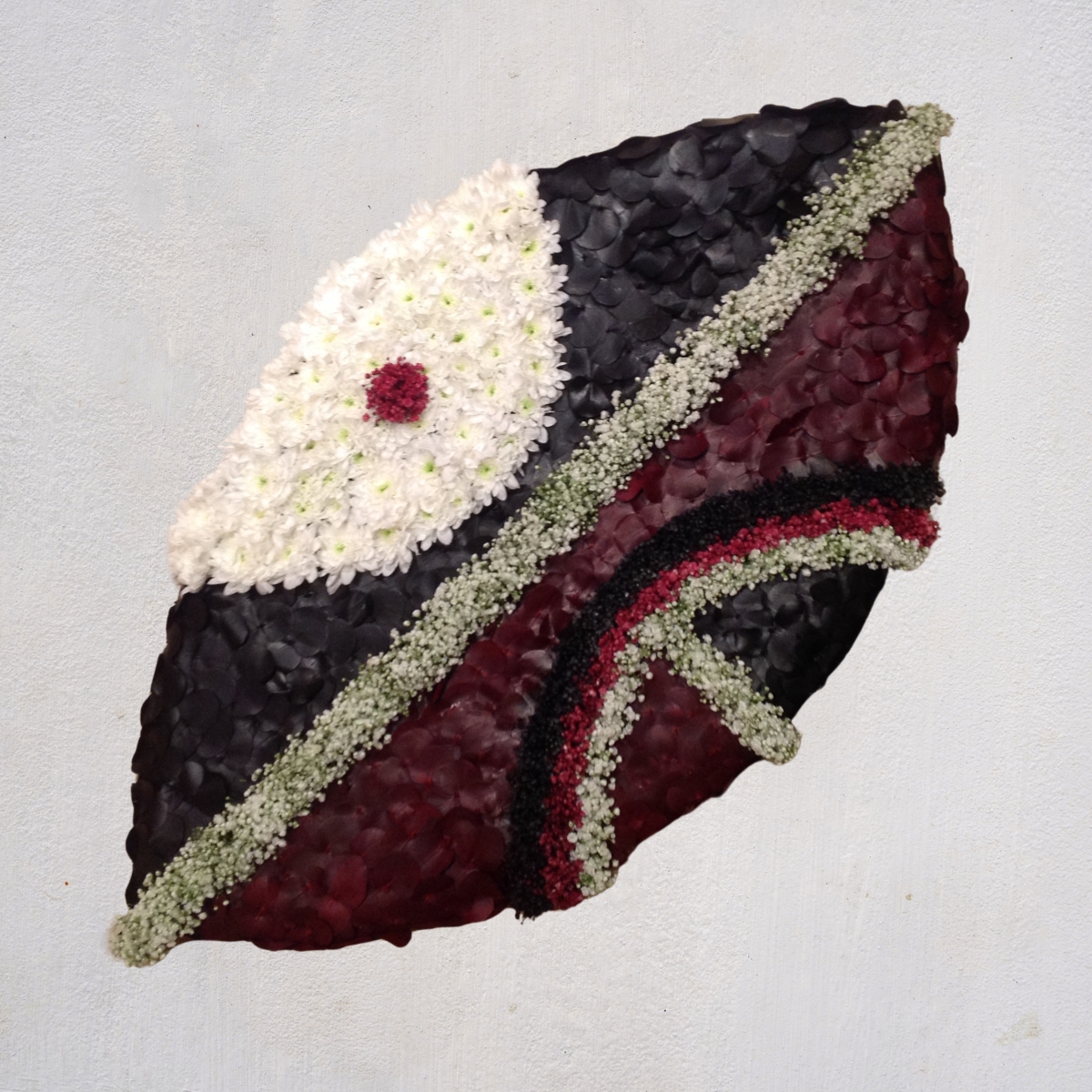 Bespoke Masai Mara shield funeral tribute by Beloved Flowers, Kent