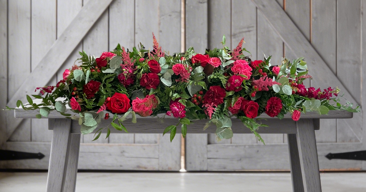 Dark pink and red rose coffin spray by Beloved Flowers, Kent