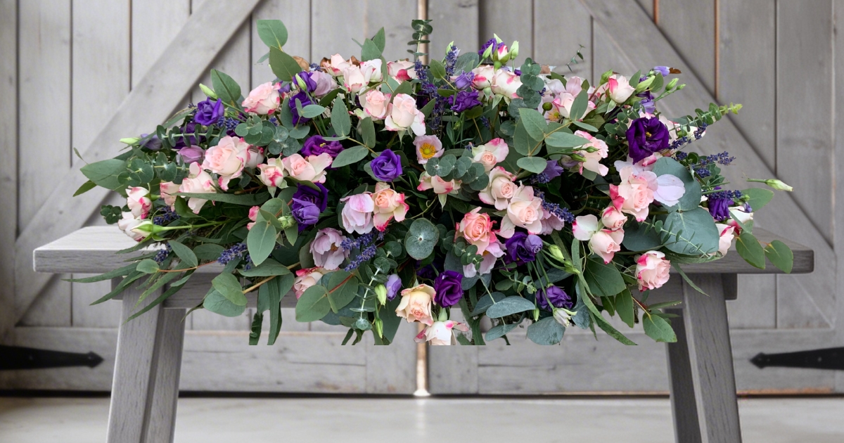 Pale pink and purple coffin spray by Beloved Flowers, Kent